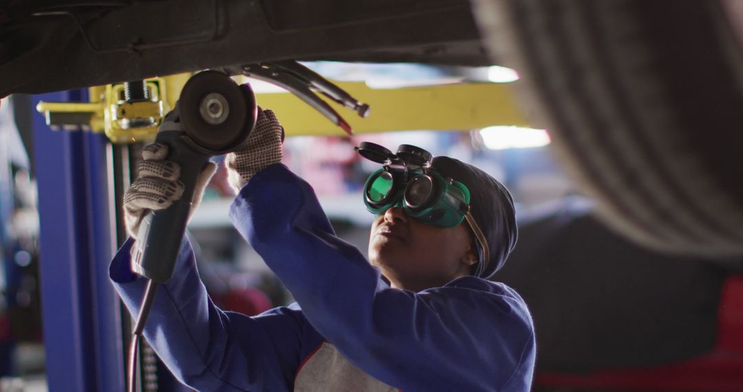 Female Auto Mechanic Using Angle Grinder in Car Workshop - Free Images, Stock Photos and Pictures on Pikwizard.com