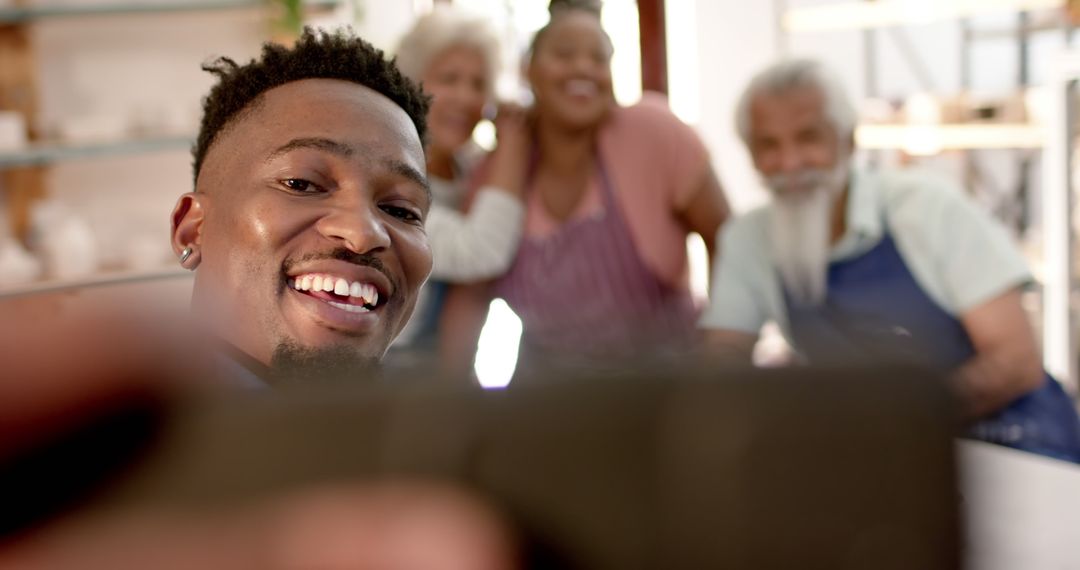 Young Man Taking Selfie with Multigenerational Family Smiling - Free Images, Stock Photos and Pictures on Pikwizard.com