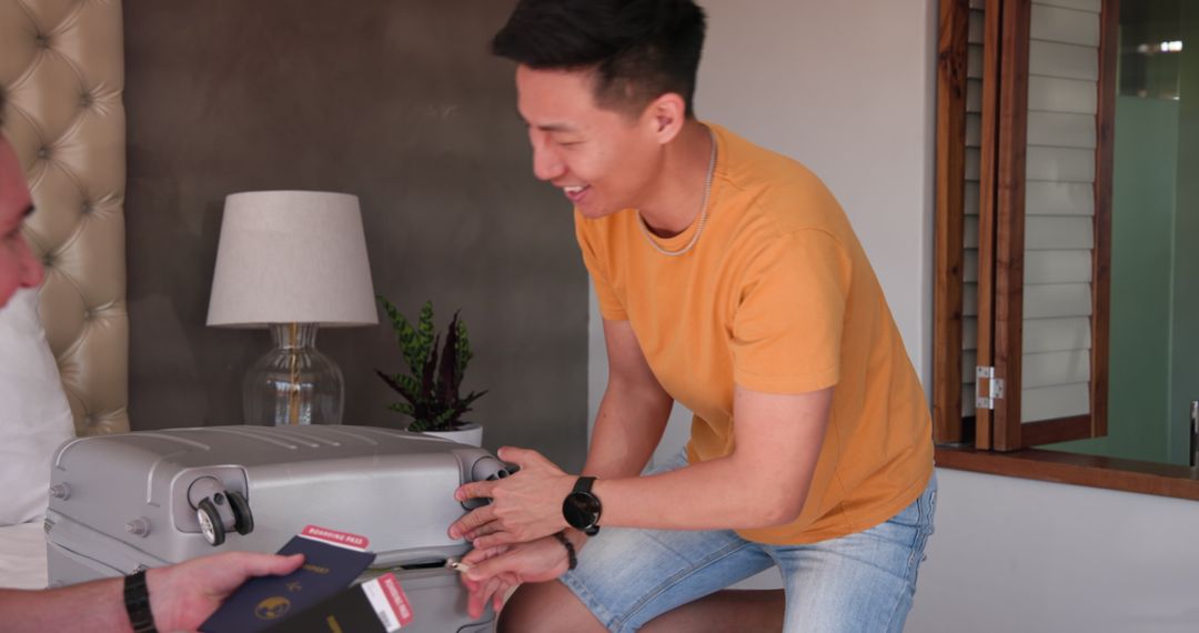 Smiling Man Packing Suitcase for Vacation At Home