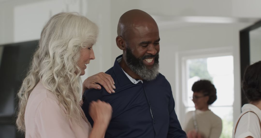 Guests Mingling and Smiling at Joyful Wedding Reception