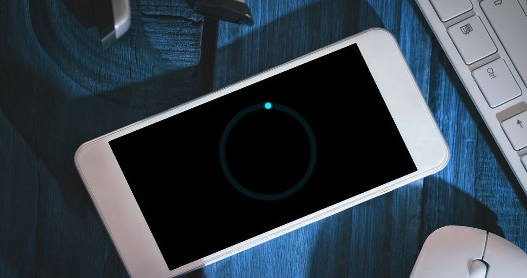 Smartphone Displaying Loading Screen Under Gentle Light - Free Images, Stock Photos and Pictures on Pikwizard.com