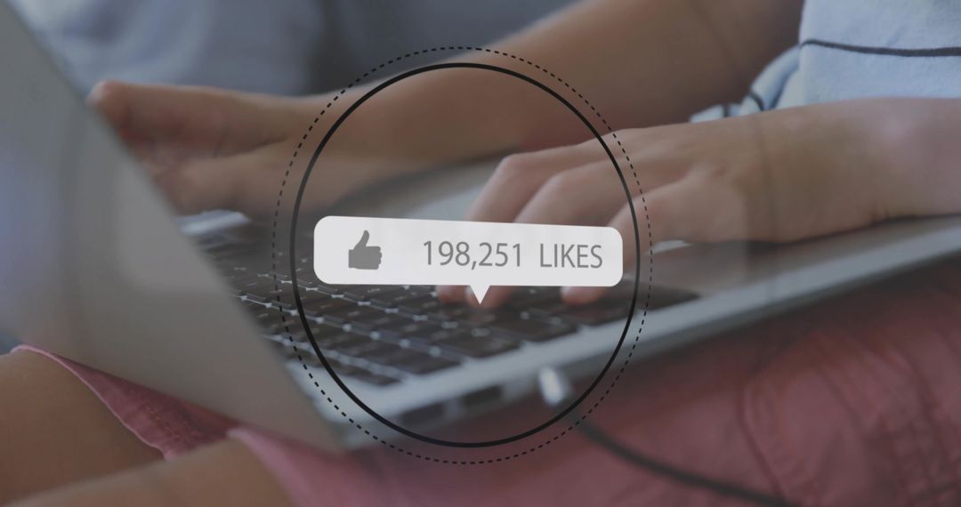 Person Using Laptop with Digital Likes Overlay on Screen