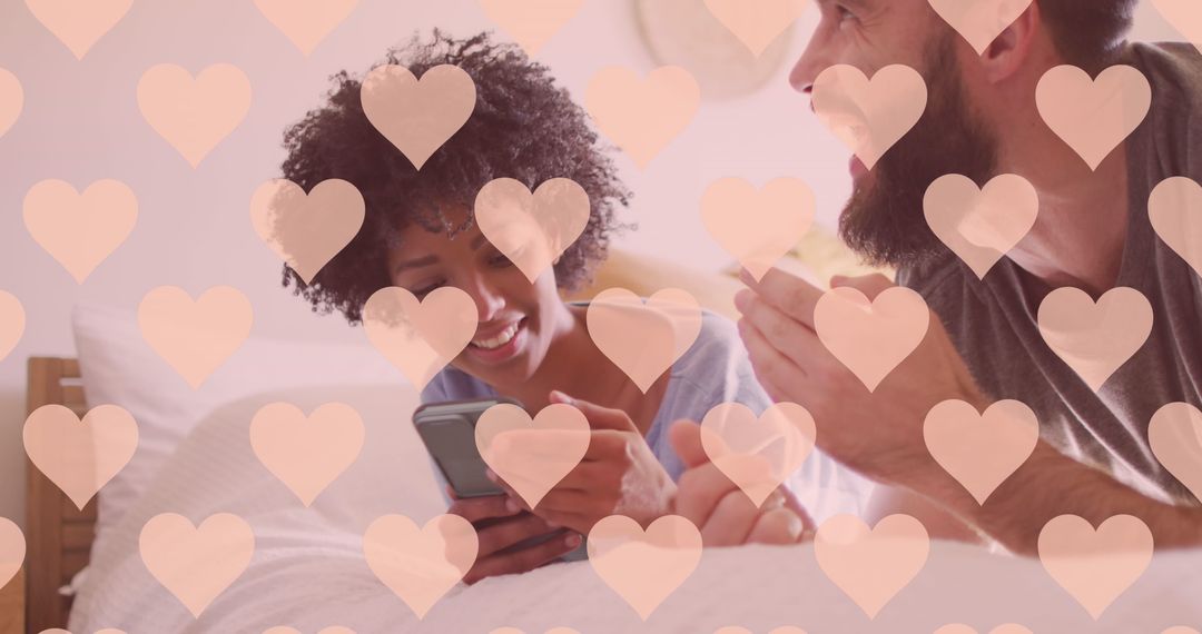 Happy Couple Using Smartphone with Romantic Heart Overlay