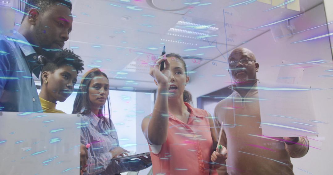 Diverse Team Collaborating on Futuristic Project in Modern Office