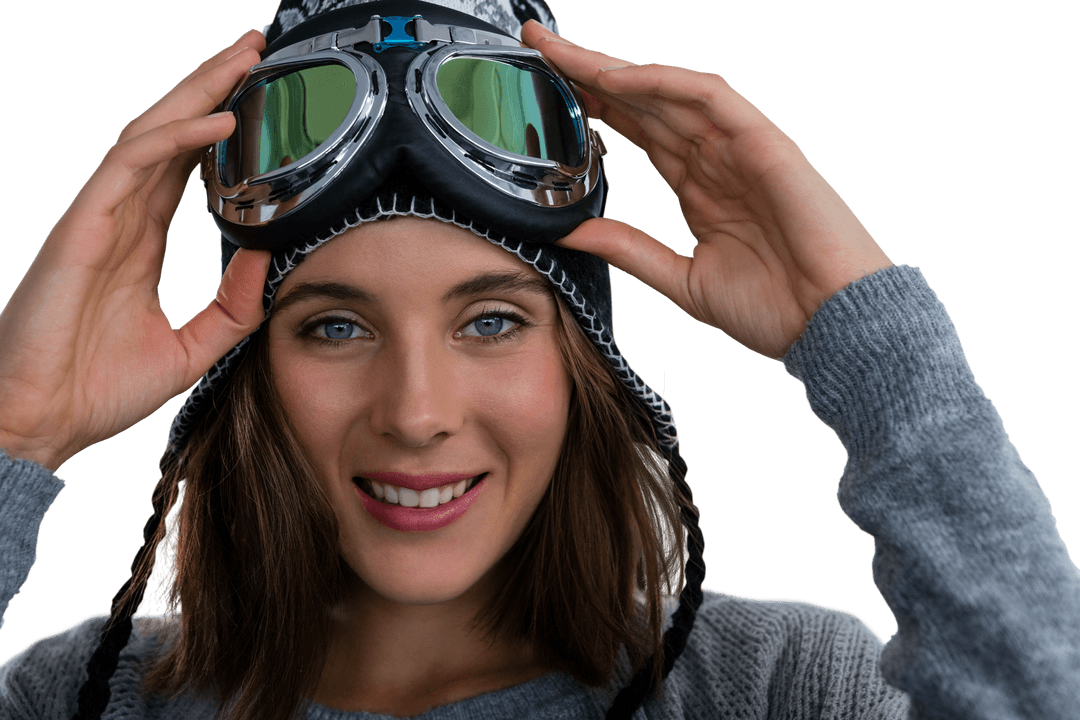 Smiling Woman with Ski Goggles Adjusting Headwear Transparent Background