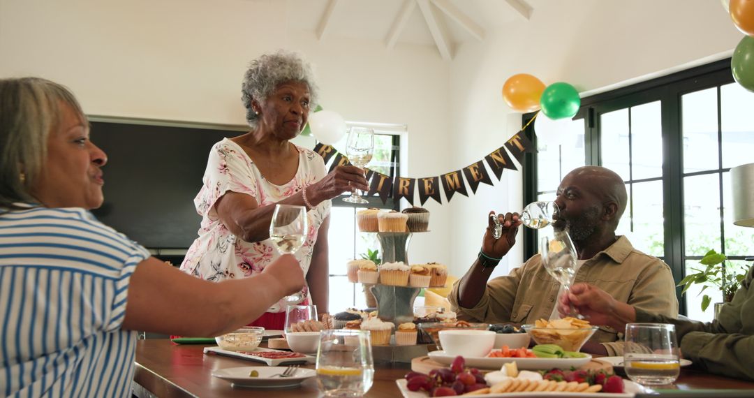 Senior Friends Celebrating Retirement with Toast and Delights