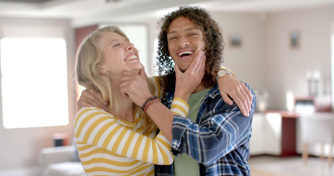 Happy Diverse Couple Embracing at Home