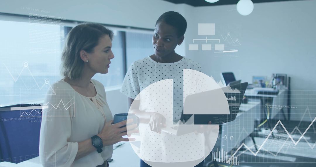 Businesswomen Collaborating on Data Analysis with Financial Charts