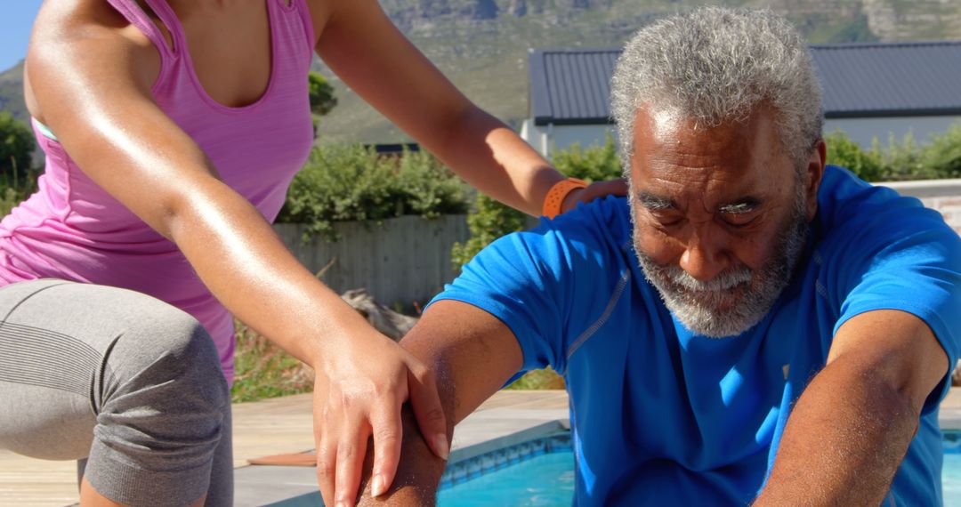 Senior Man Stretching with Trainer Outdoors by Pool - Free Images, Stock Photos and Pictures on Pikwizard.com