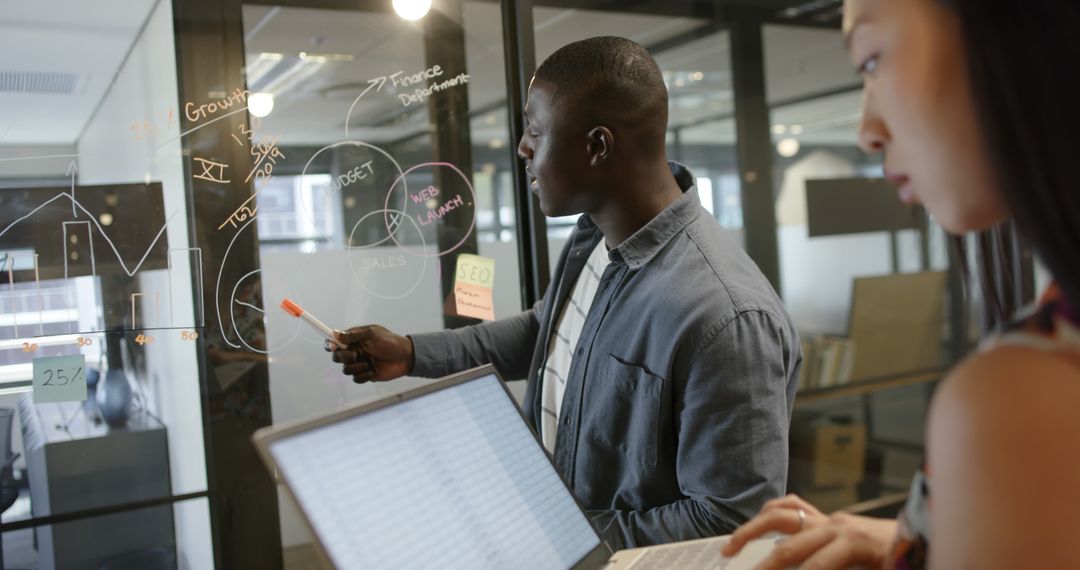 Teamwork in Modern Office with Business Strategy Presentation