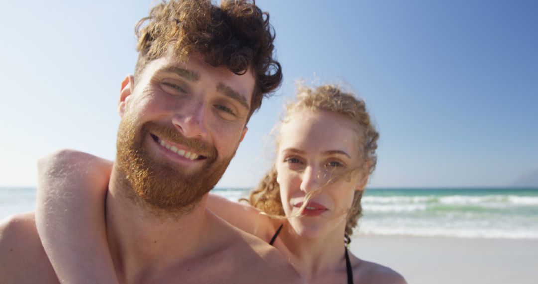 Joyful Couple Taking a Selfie on Sunny Beach