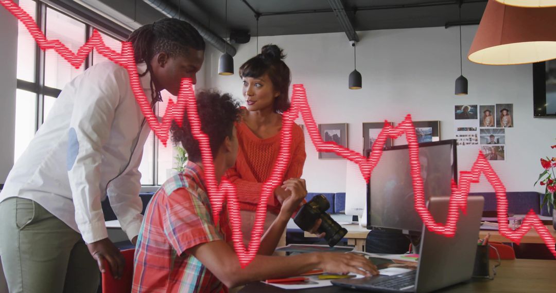 Team Analyzing Digital Trends in Modern Office with Graph Overlay