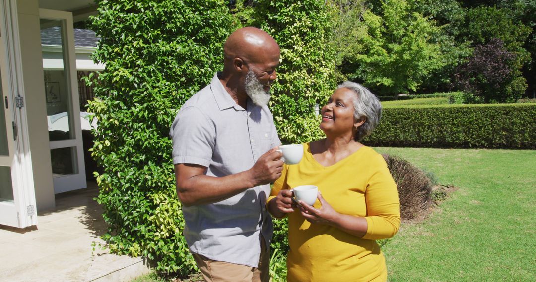 Senior Couple Enjoying Tea and Conversation in Garden
