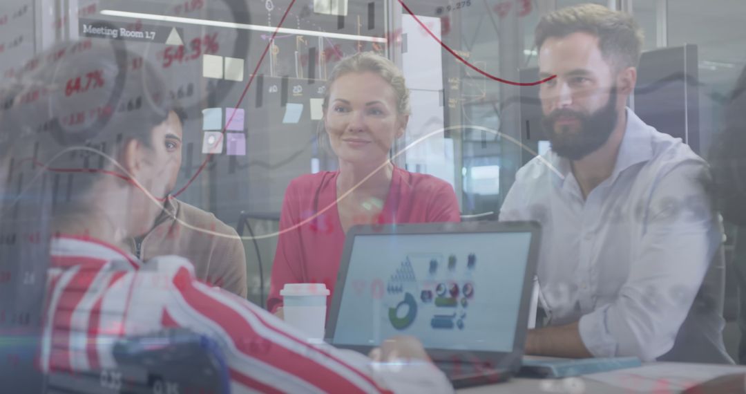 Colleagues Collaborating in a Modern Office with Data Graphics