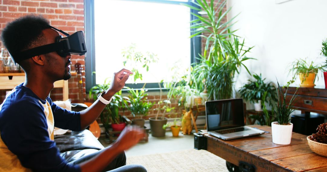 Man Enjoying Virtual Reality Experience in Bright Cozy Living Room - Free Images, Stock Photos and Pictures on Pikwizard.com