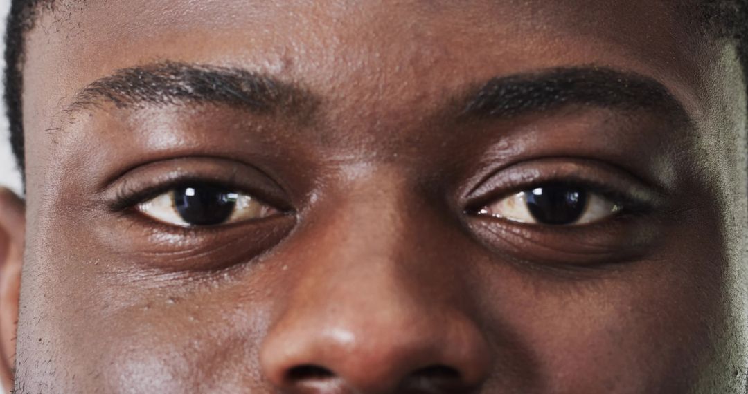Close-Up of Focused African American Eyes, Confidence and Emotion
