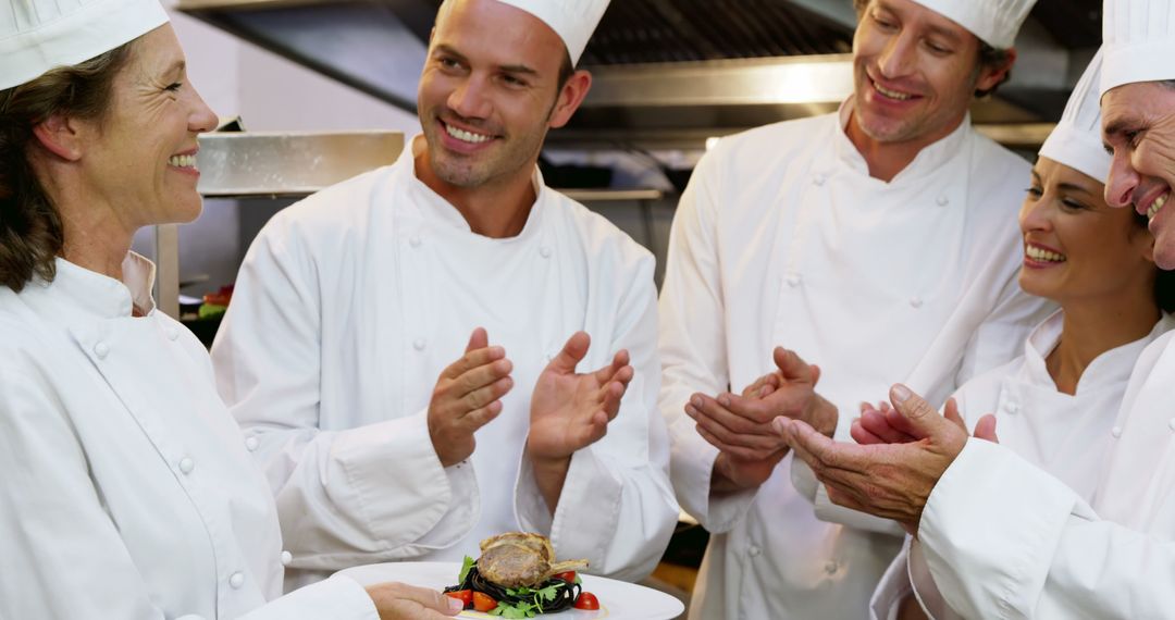 Team of Chefs Celebrating in Restaurant Kitchen - Free Images, Stock Photos and Pictures on Pikwizard.com