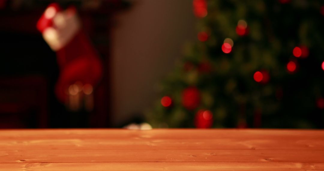 Festive Wooden Table with Christmas Tree in Background