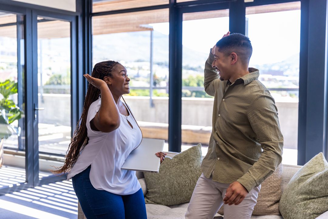 Diverse Coworkers Celebrating Success in Contemporary Office Space