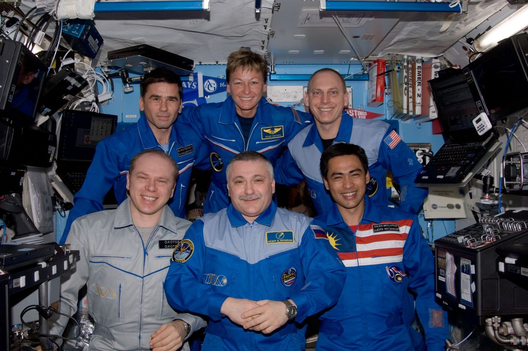 Expedition 15 and Expedition 16 Crewmembers pose for a photo in the US Lab - Free Images, Stock Photos and Pictures on Pikwizard.com