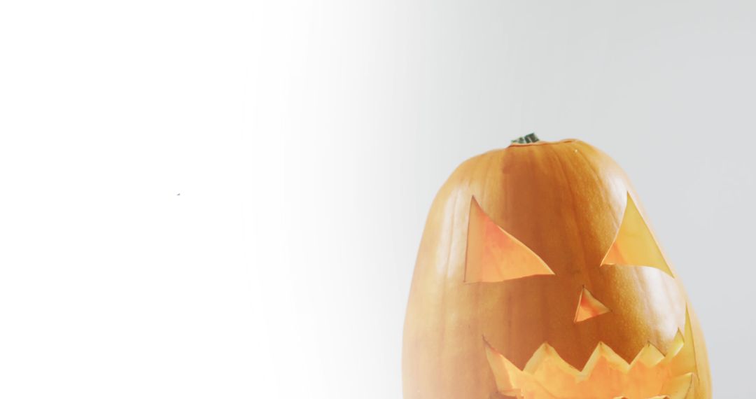 Carved Halloween Pumpkin with Glowing Face