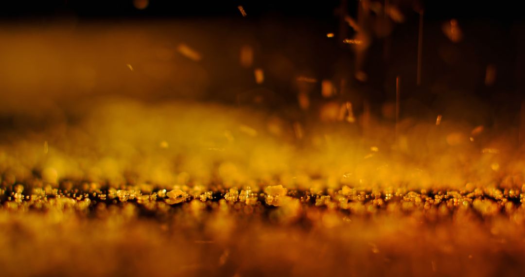 Warm Raindrops Hitting Ground at Night with Copy Space