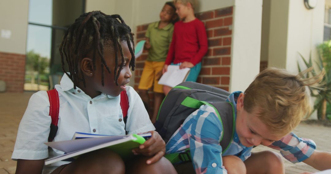 Joyful Diverse Boys Engaging with Books at School Entrance