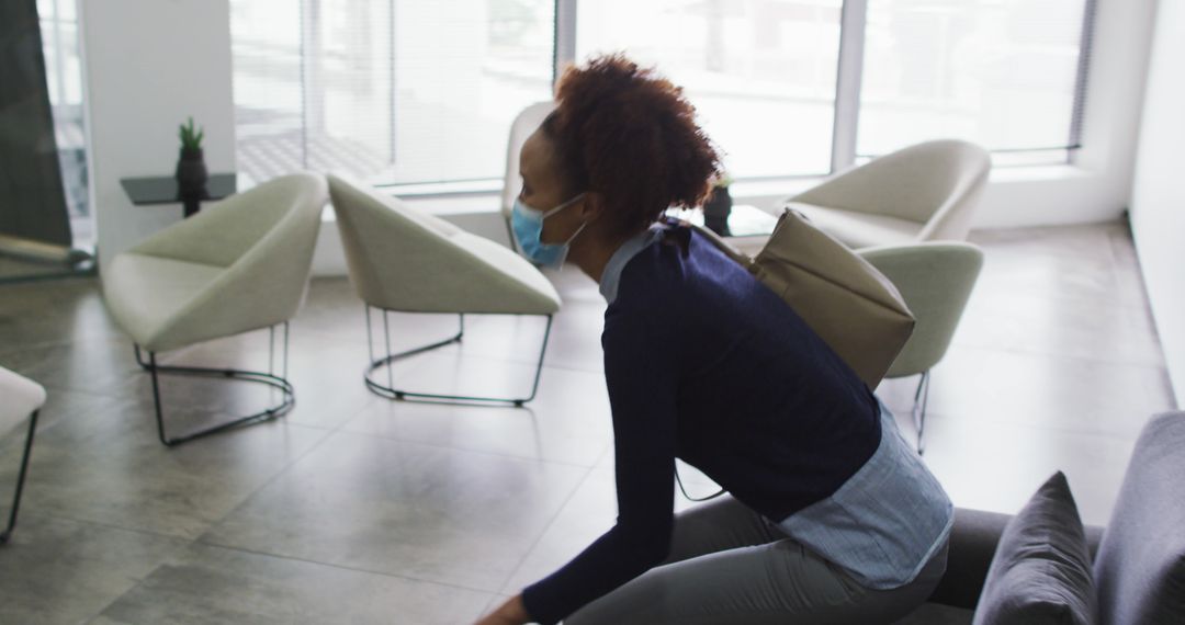 Woman Wearing Mask in Modern Office Interior - Free Images, Stock Photos and Pictures on Pikwizard.com