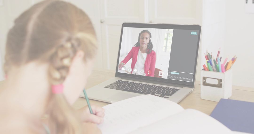 Student Participating in Online Learning via Laptop at Home