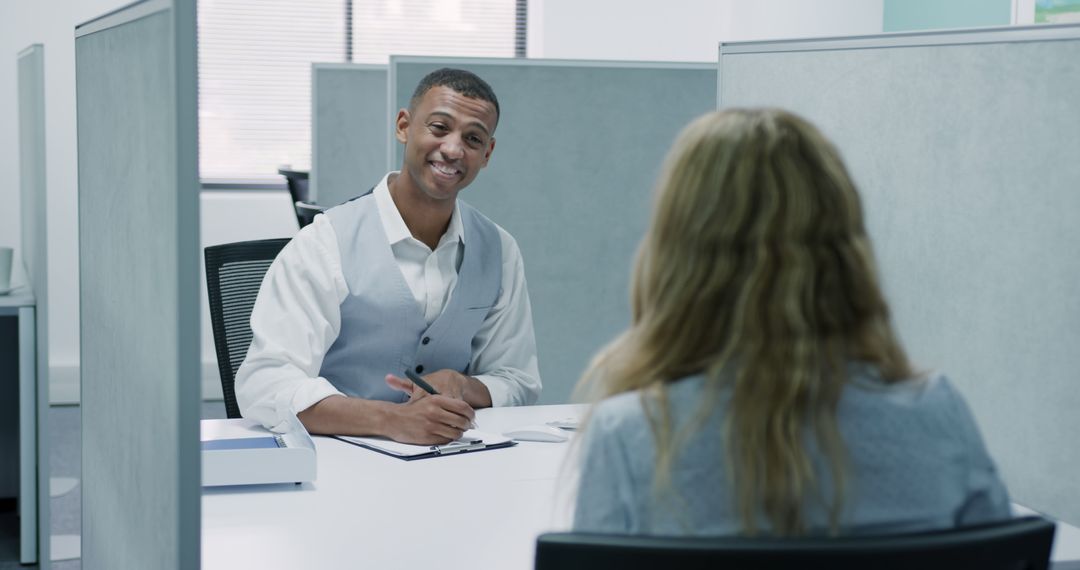 Smiling Employer Interviewing Candidate in Office Cubicle - Free Images, Stock Photos and Pictures on Pikwizard.com