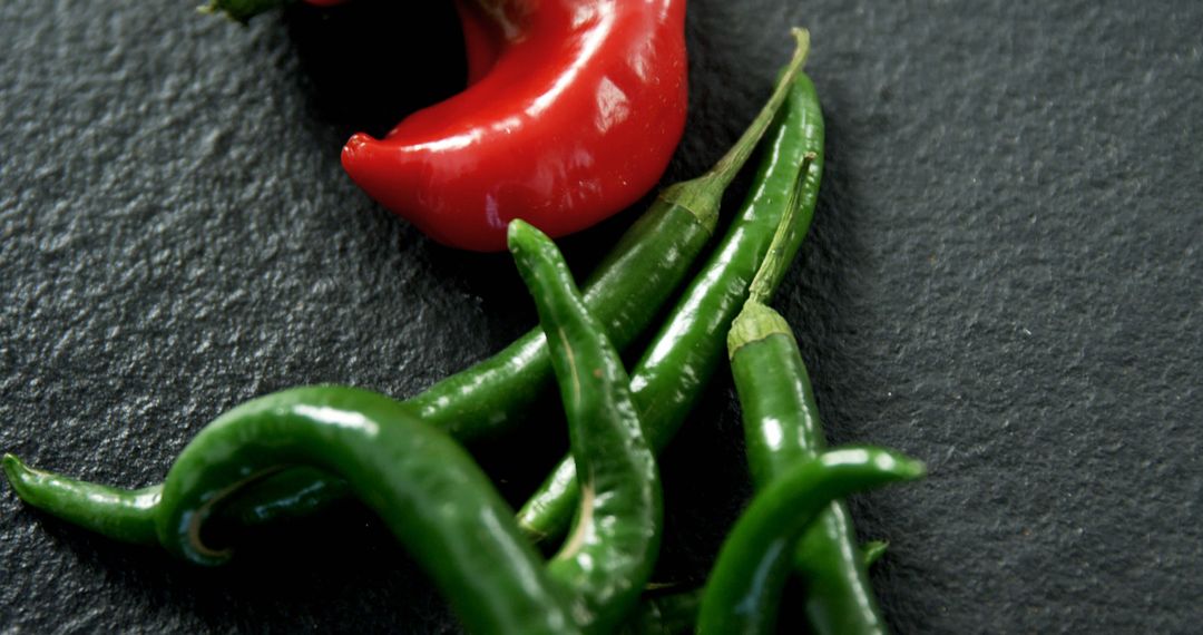 Close-up of Freshly Harvested Red and Green Chili Peppers on Dark Background - Free Images, Stock Photos and Pictures on Pikwizard.com