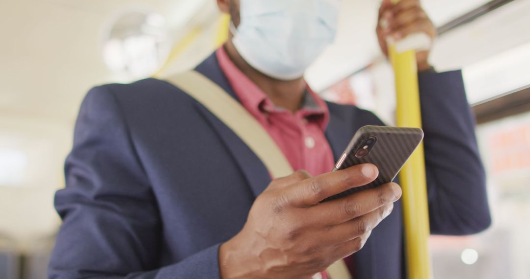 Businessman Using Smartphone on Public Bus with Face Mask During Pandemic