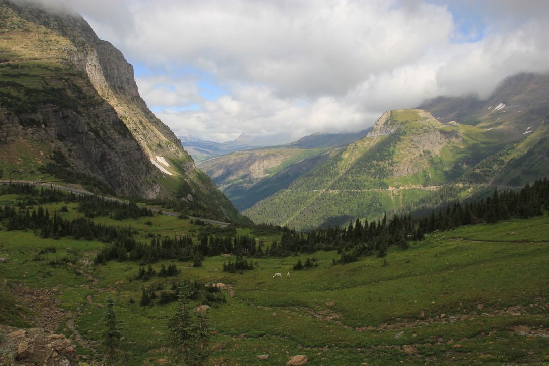 Scenic Mountain Valley with Lush Greenery and Vast Landscape - Free Images, Stock Photos and Pictures on Pikwizard.com
