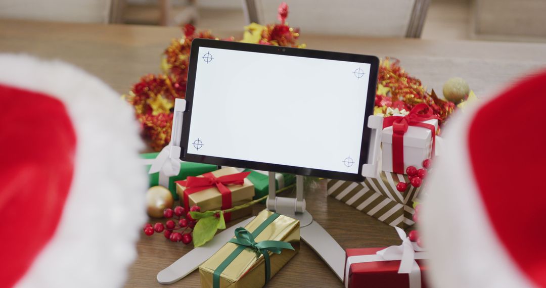 Tablet Displaying Blank Screen Surrounded by Christmas Decorations and Gifts - Free Images, Stock Photos and Pictures on Pikwizard.com