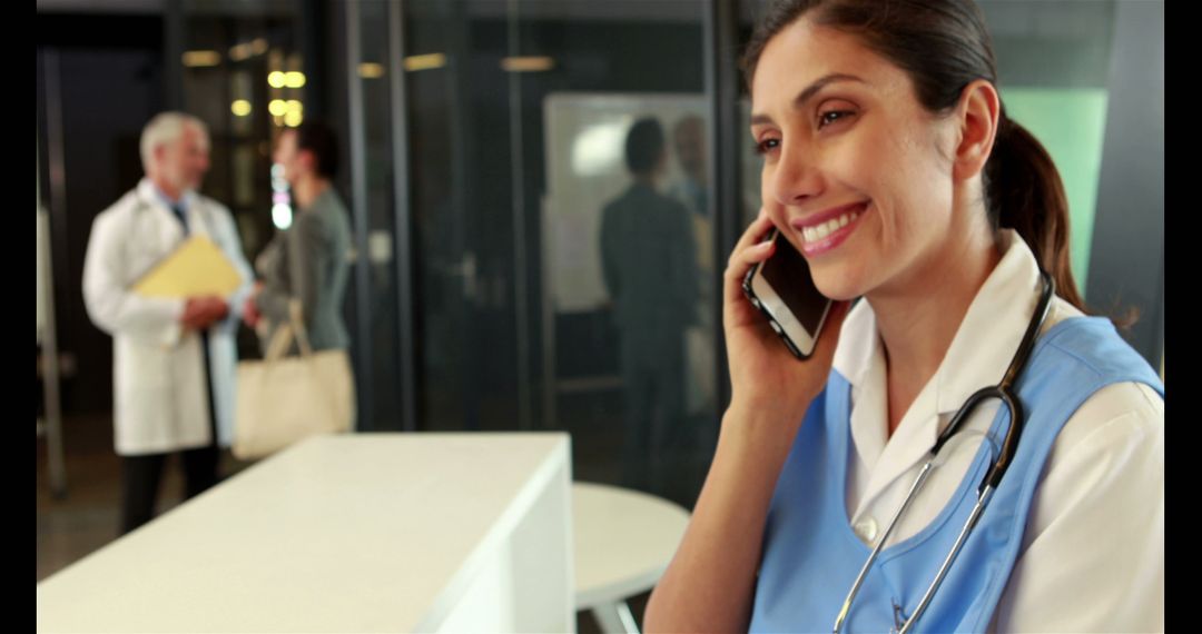 Female Nurse Talking on Phone in Hospital - Free Images, Stock Photos and Pictures on Pikwizard.com