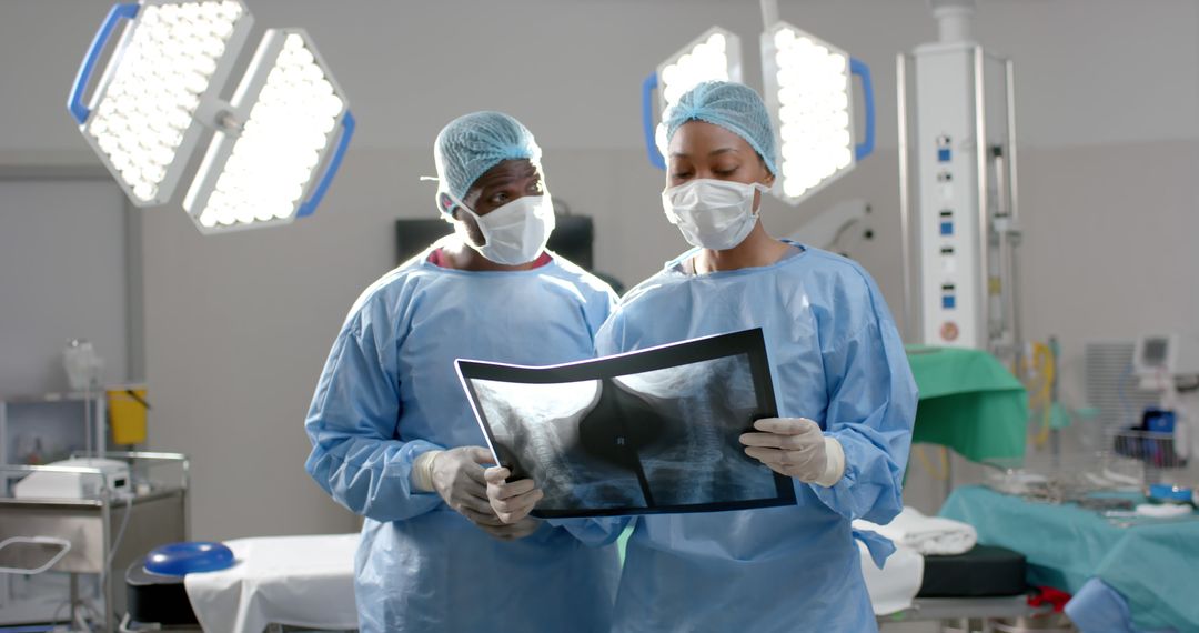 Doctors Examining X-Ray in Surgical Suite - Free Images, Stock Photos and Pictures on Pikwizard.com