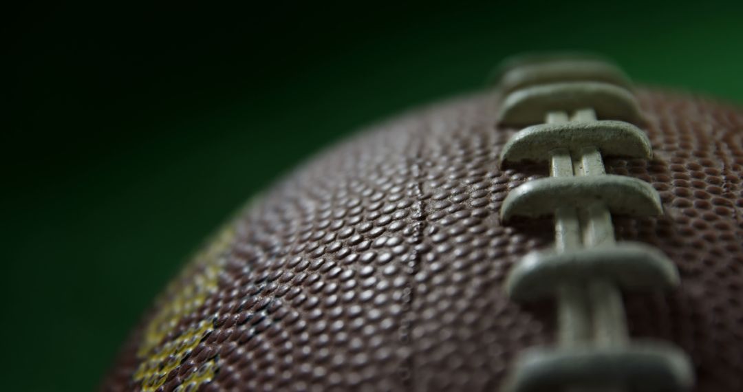 Close-up of a Football on Green Background - Free Images, Stock Photos and Pictures on Pikwizard.com