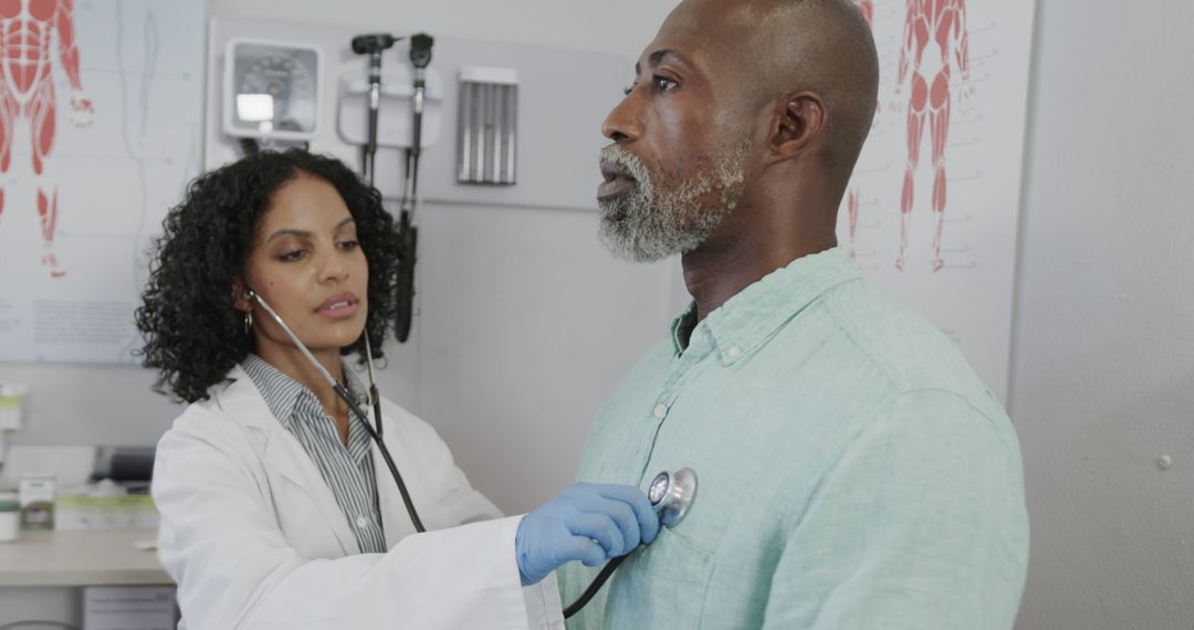 Doctor Checking Male Patient's Heartbeat with Stethoscope in Clinic - Free Images, Stock Photos and Pictures on Pikwizard.com