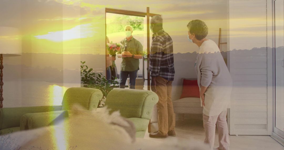 Masked hosts greeting visitor with bouquet at front door during warm golden hour light