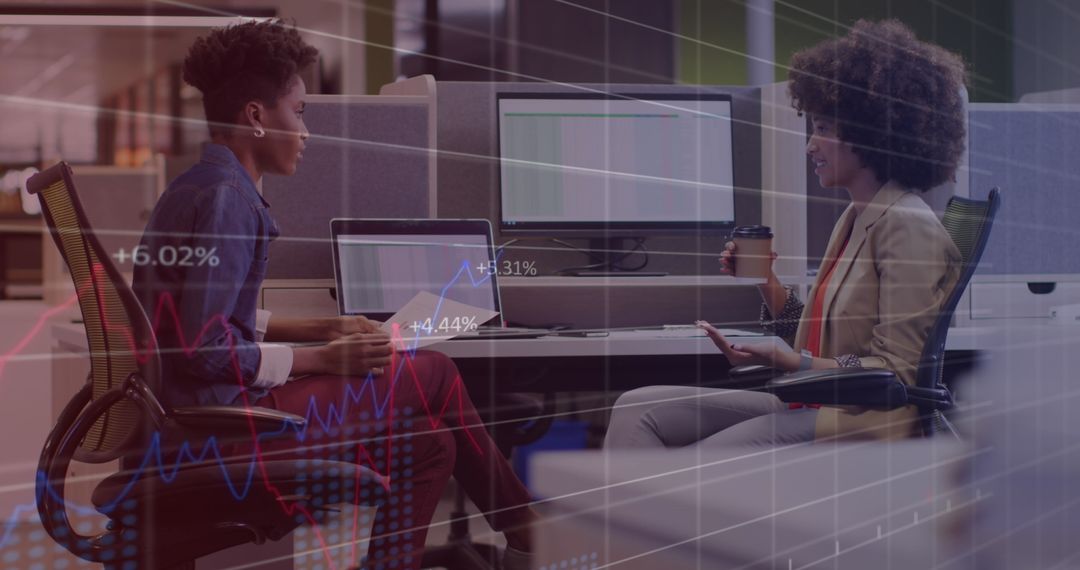 Diverse Businesswomen Discussing with Data Analytics Overlay