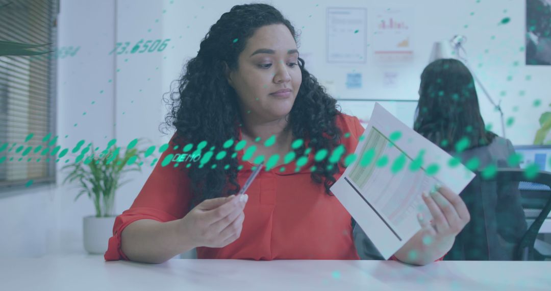 Biracial Businesswoman Analyzing Reports with Digital Overlay