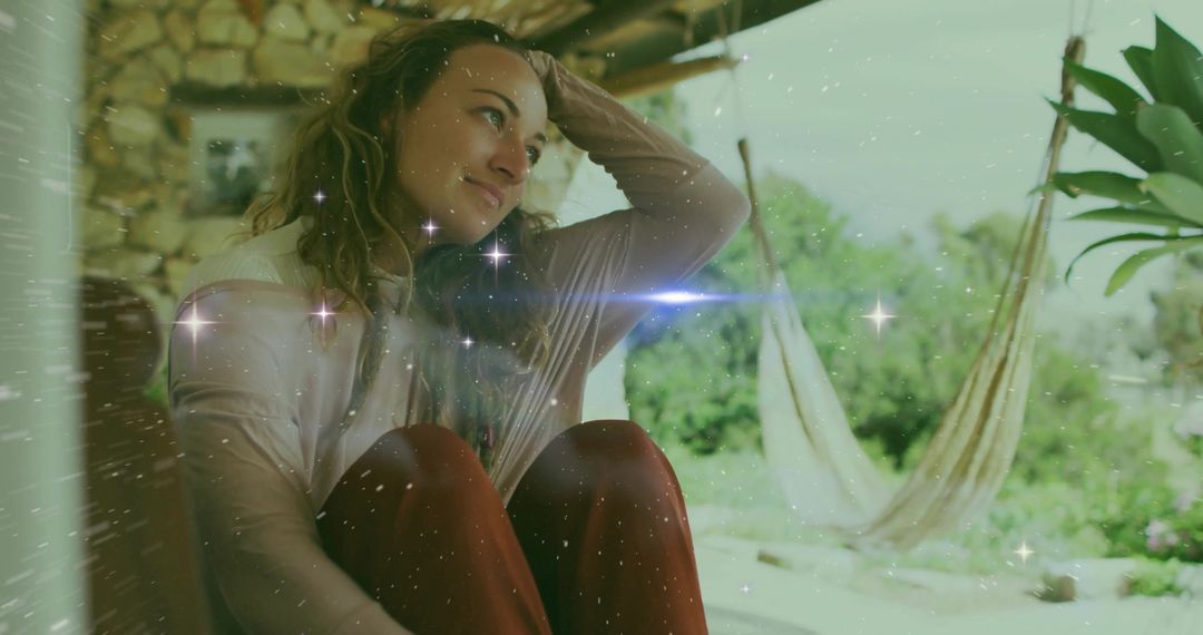 Contemplative Woman Relaxing on Porch with Hammocks and Garden View