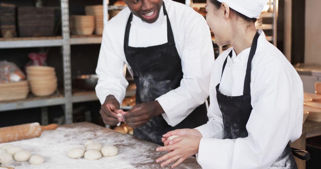 Two Bakers Preparing Dough in Commercial Kitchen - Free Images, Stock Photos and Pictures on Pikwizard.com