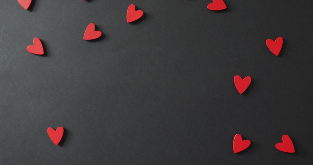 Scattered Red Hearts on Gray Background for Valentine's Day