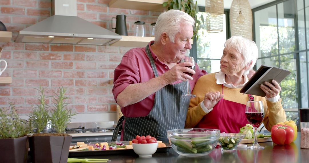 Senior Couple Cooking Together and Drinking Wine in Modern Kitchen - Free Images, Stock Photos and Pictures on Pikwizard.com