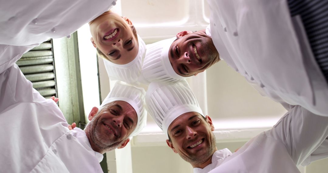 Group of Chefs in Kitchen Smiling Down at Camera - Free Images, Stock Photos and Pictures on Pikwizard.com