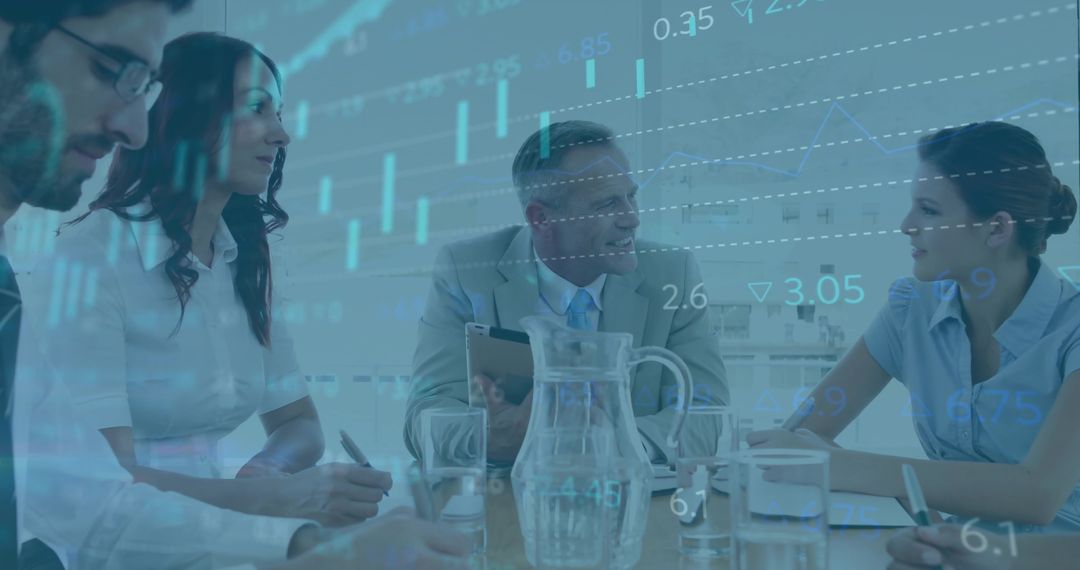 Diverse Business Team Analyzing Data Visualizations at Conference Table