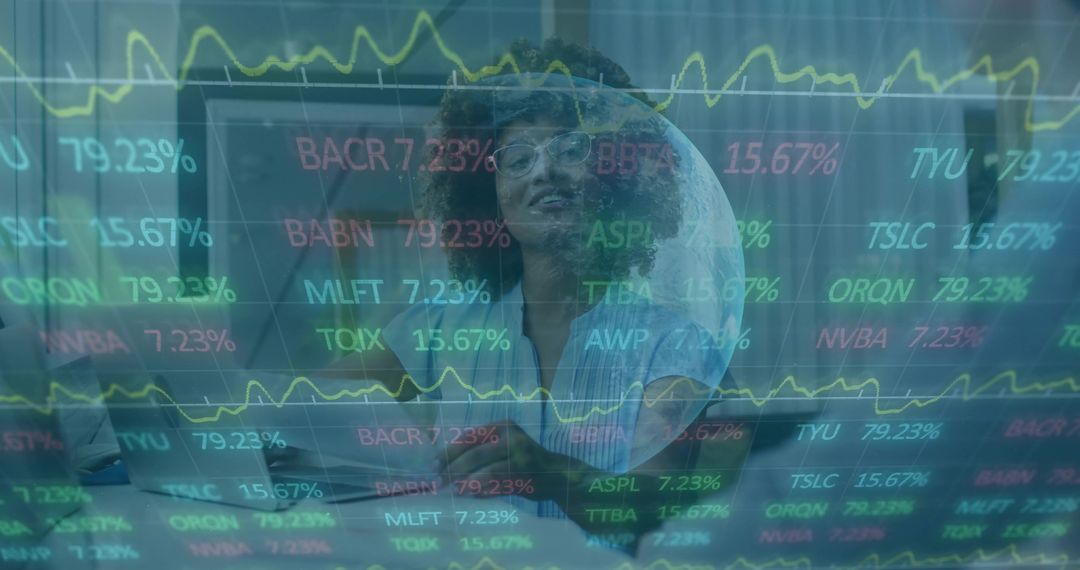 Female Analyst Monitoring Stock Market Data on Laptop in Tech Workspace