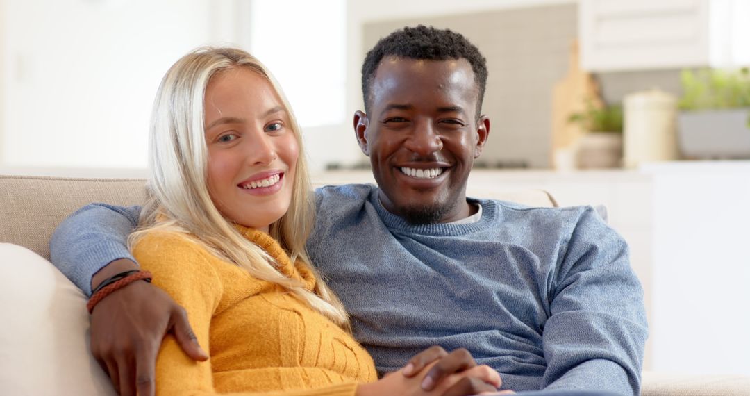 Diverse Couple Enjoying Cozy Moments in Modern Living Room