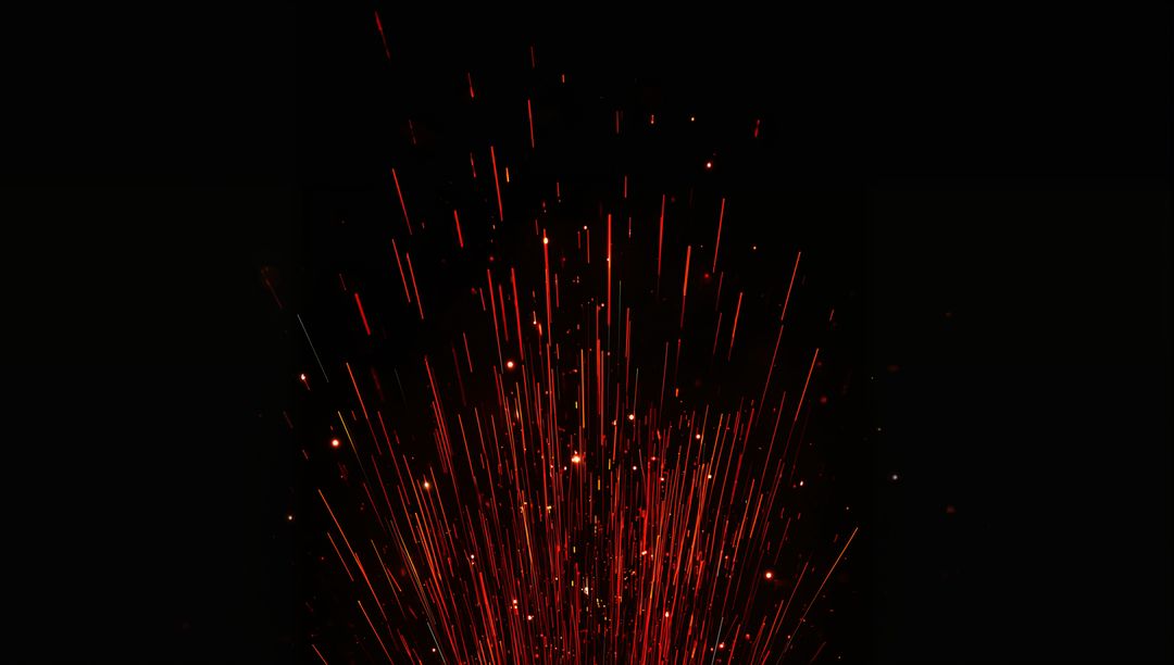 Vertical Red Spark Fountain Rising with Long Exposure Light Trails on Black Background